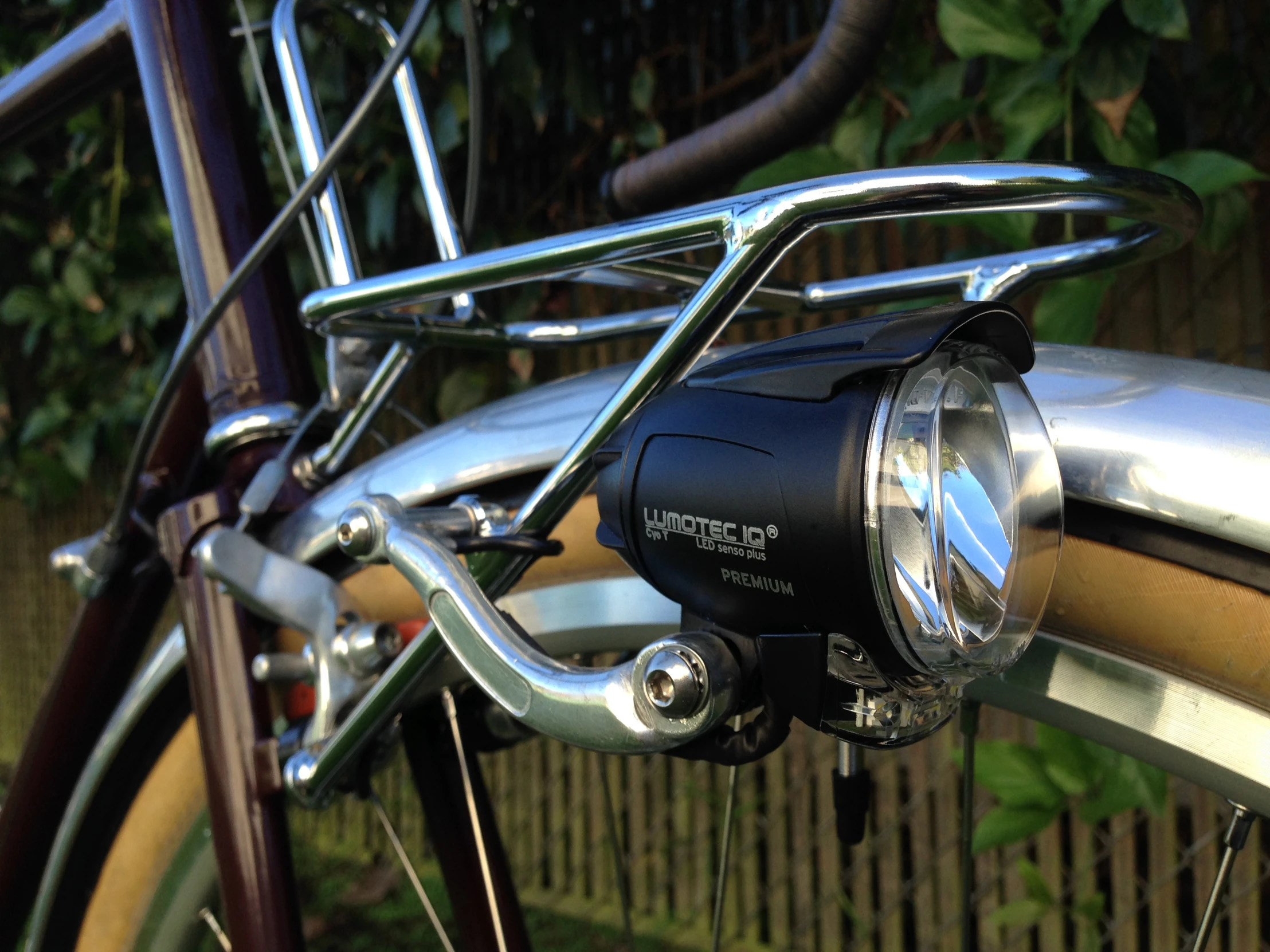 the front light is attached to the bike's handlebars