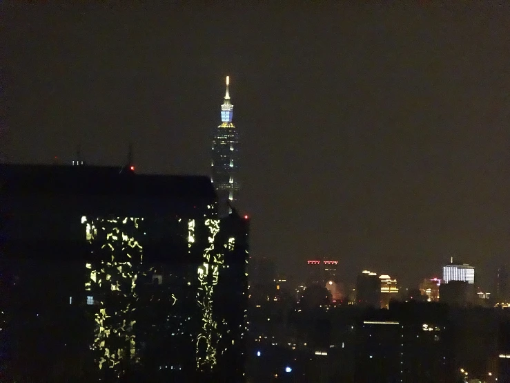 a dark night view of a cityscape at night with lights on