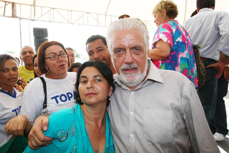 a man and woman smile as they stand next to each other