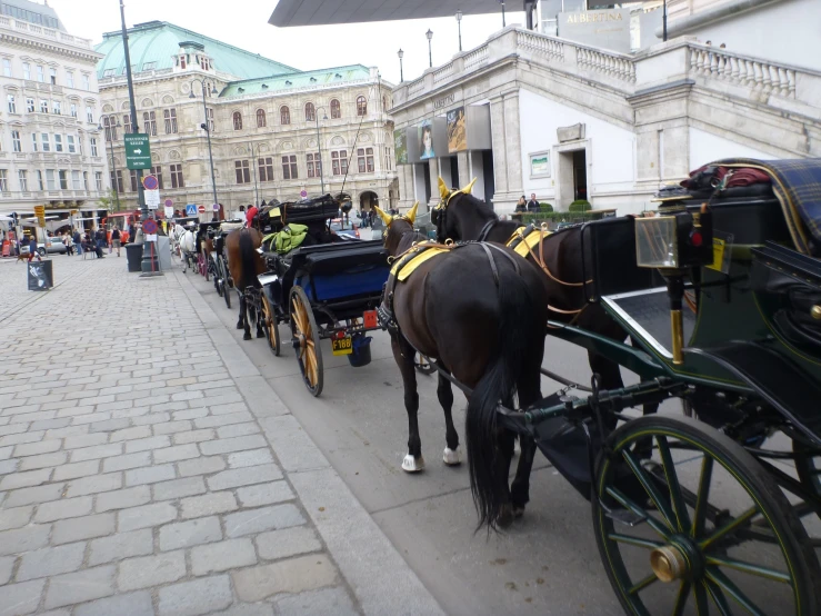 horses pulling a carriage with two men on it