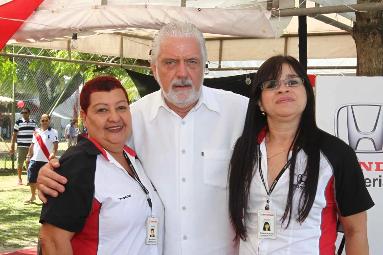 a couple of women and an old man with a cigarette