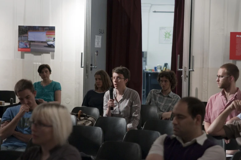 a group of people sitting together in a room