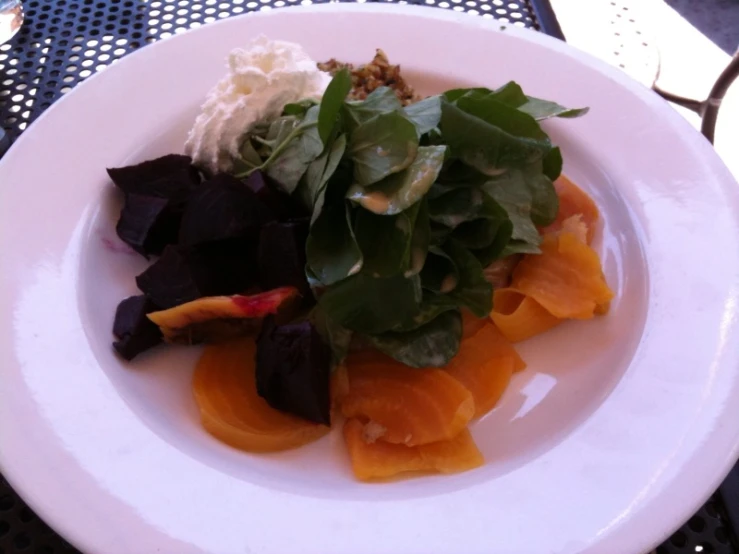 salad in a white bowl on a table