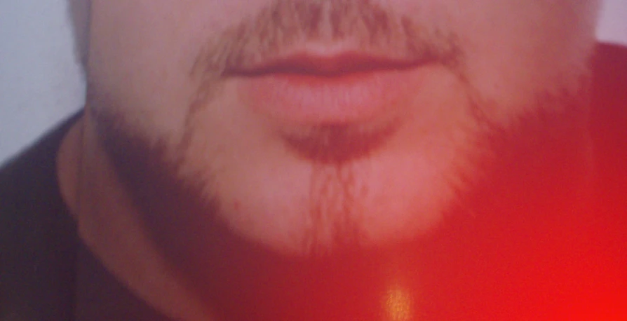 closeup of a man with a mustache and 