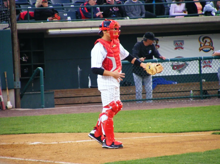 the baseball player is wearing a mask on his face