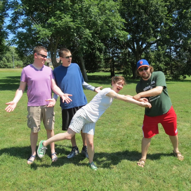 a family playing a game of frisbee on the grass