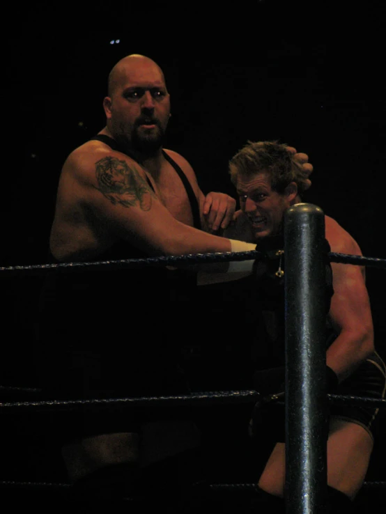 two men fighting while in the ring