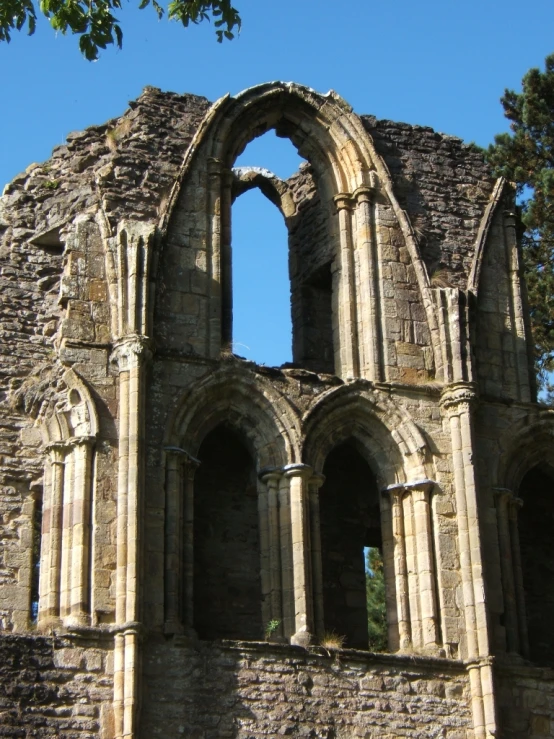 a very old church with big arched windows