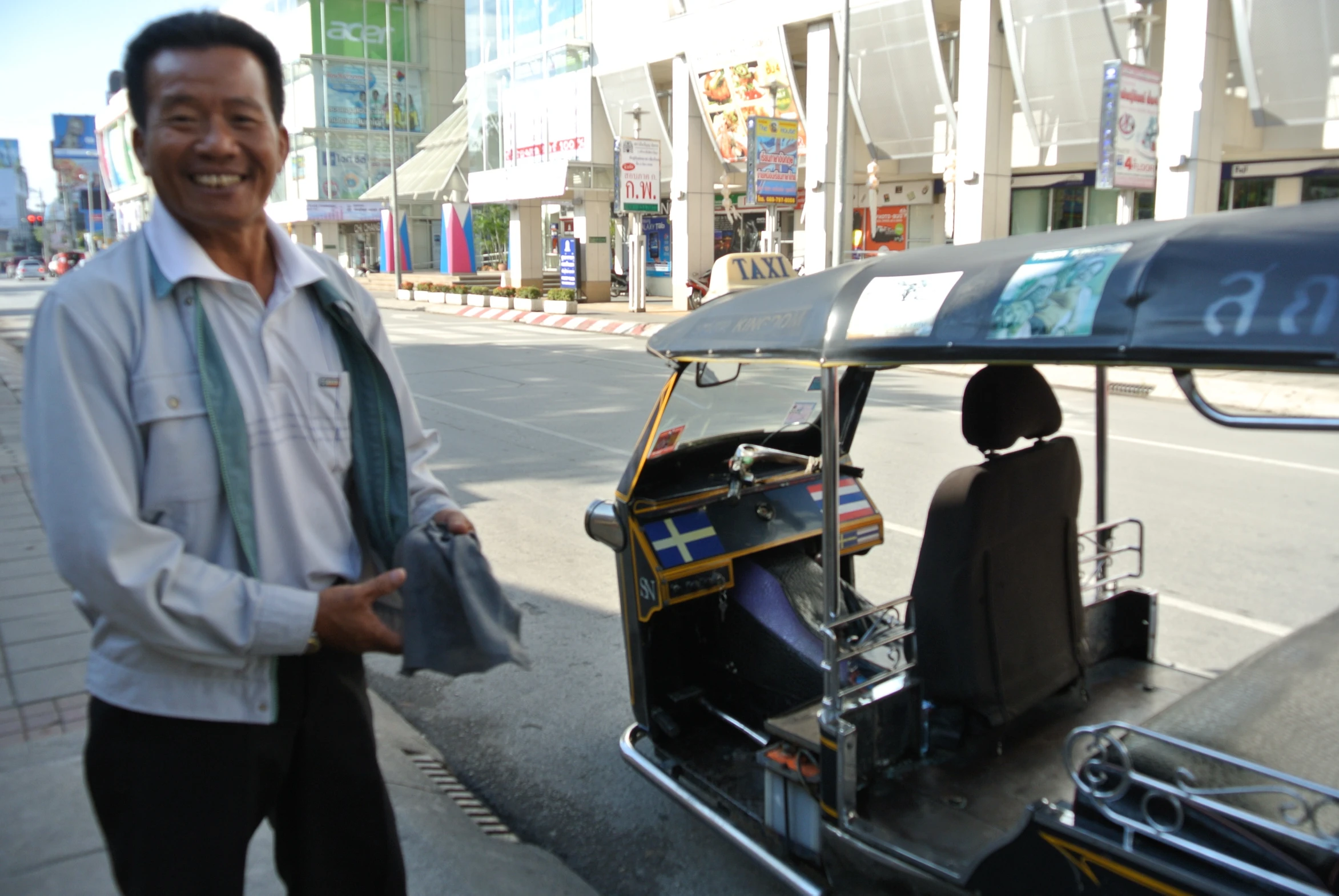 an old man standing next to a motorized vehicle