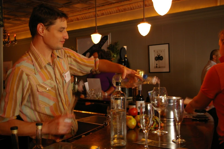 a man that is standing at a bar