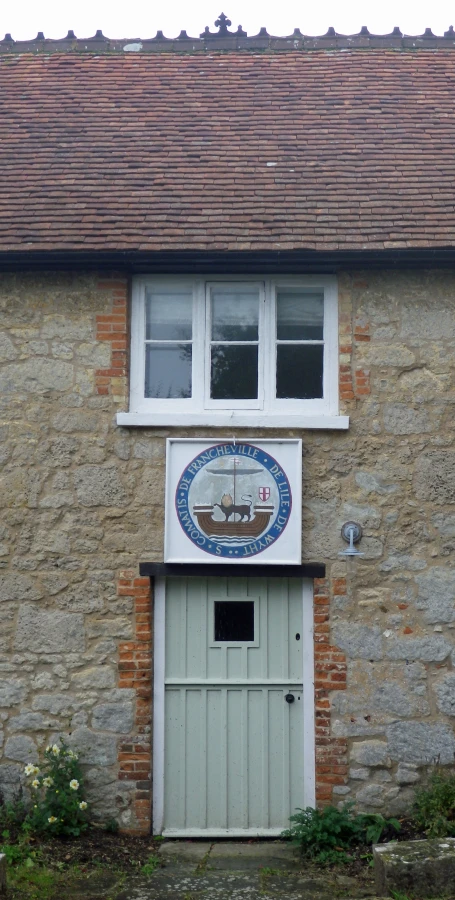 there is a blue and white clock on a wall in the door