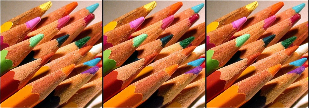 several different colored pencils arranged neatly in a box