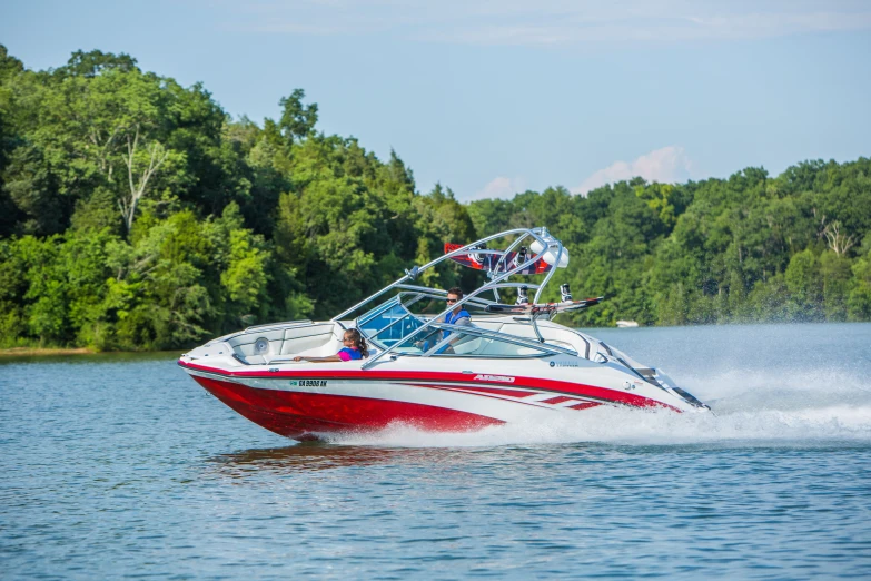 a speedboat moving through the water in the wilderness