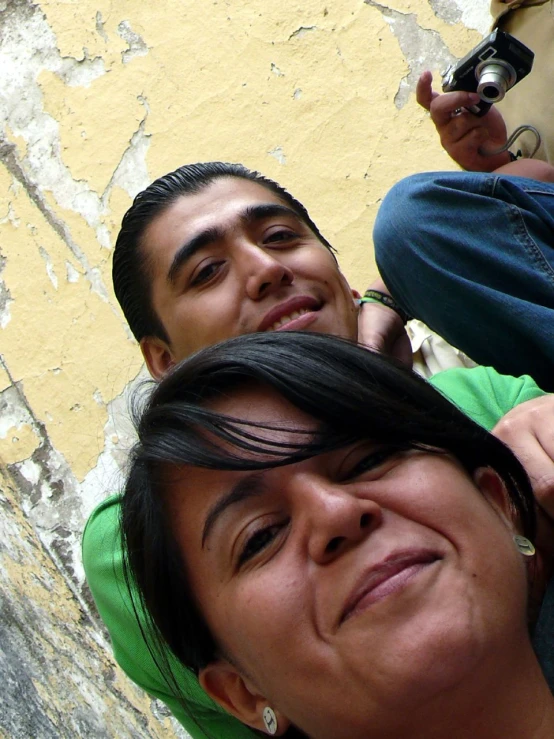 a woman laying on her side next to a man