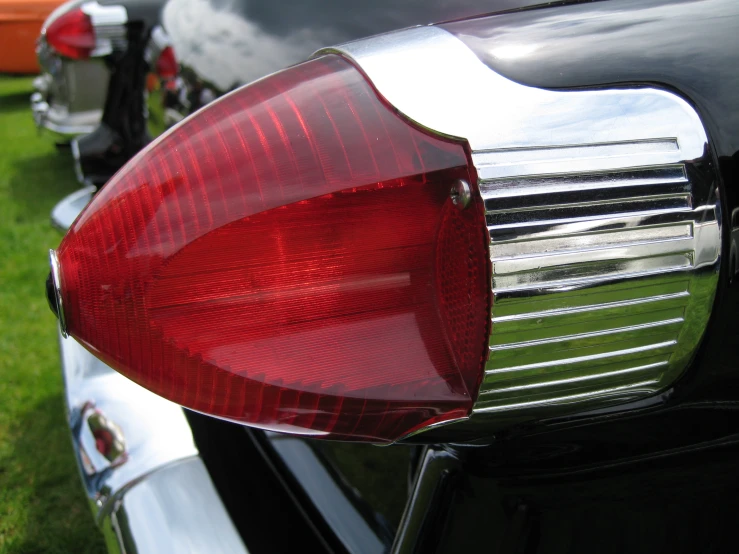 an image of a car tail light in the grass