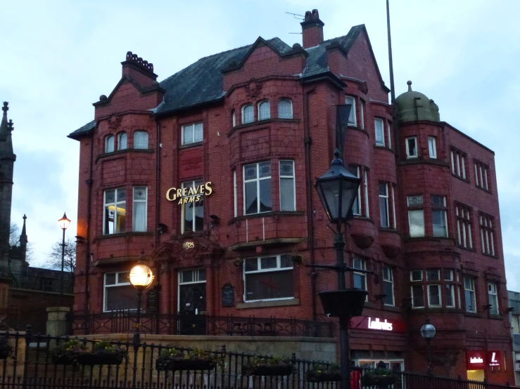 the large red building has a light on it