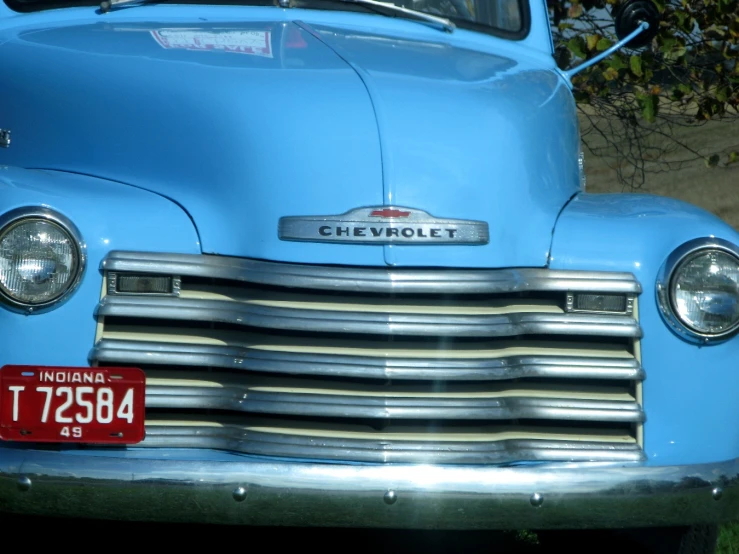 the front end of an antique pick up truck