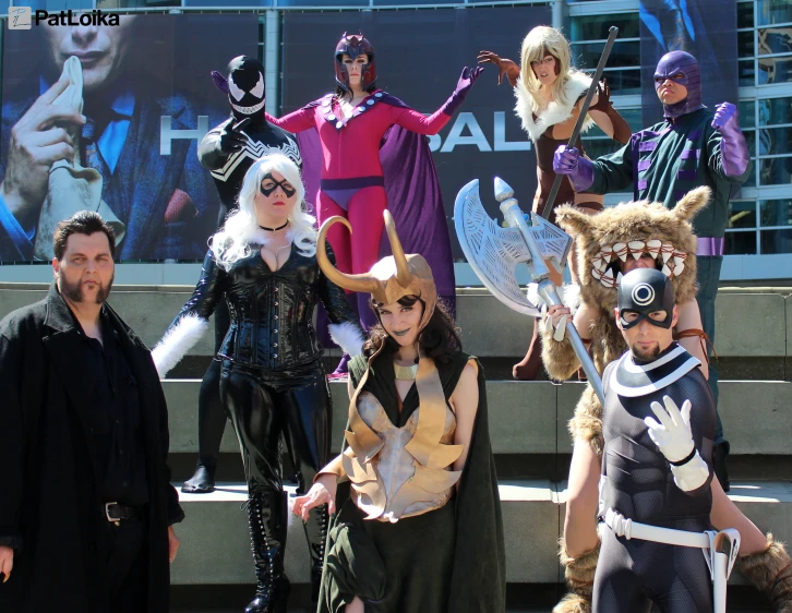 an image of people standing around on the steps wearing costume