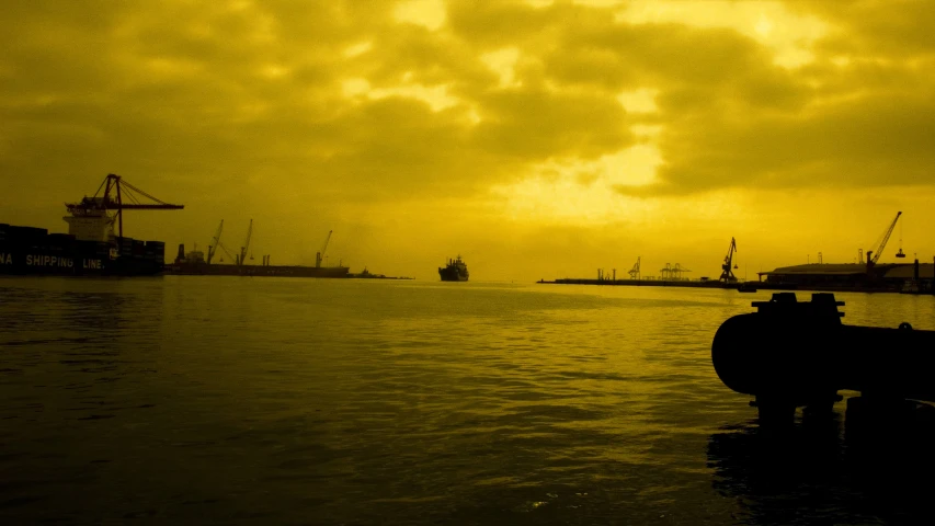 a harbor area with a big amount of sea in the background