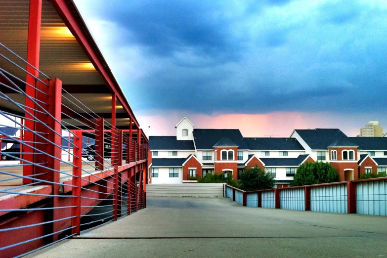 a red and white building with gray and black roofs