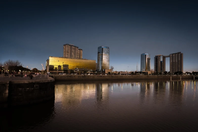 buildings reflecting on the water in front of them