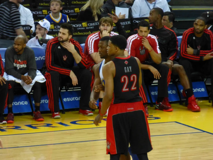 the basketball player is standing on the court