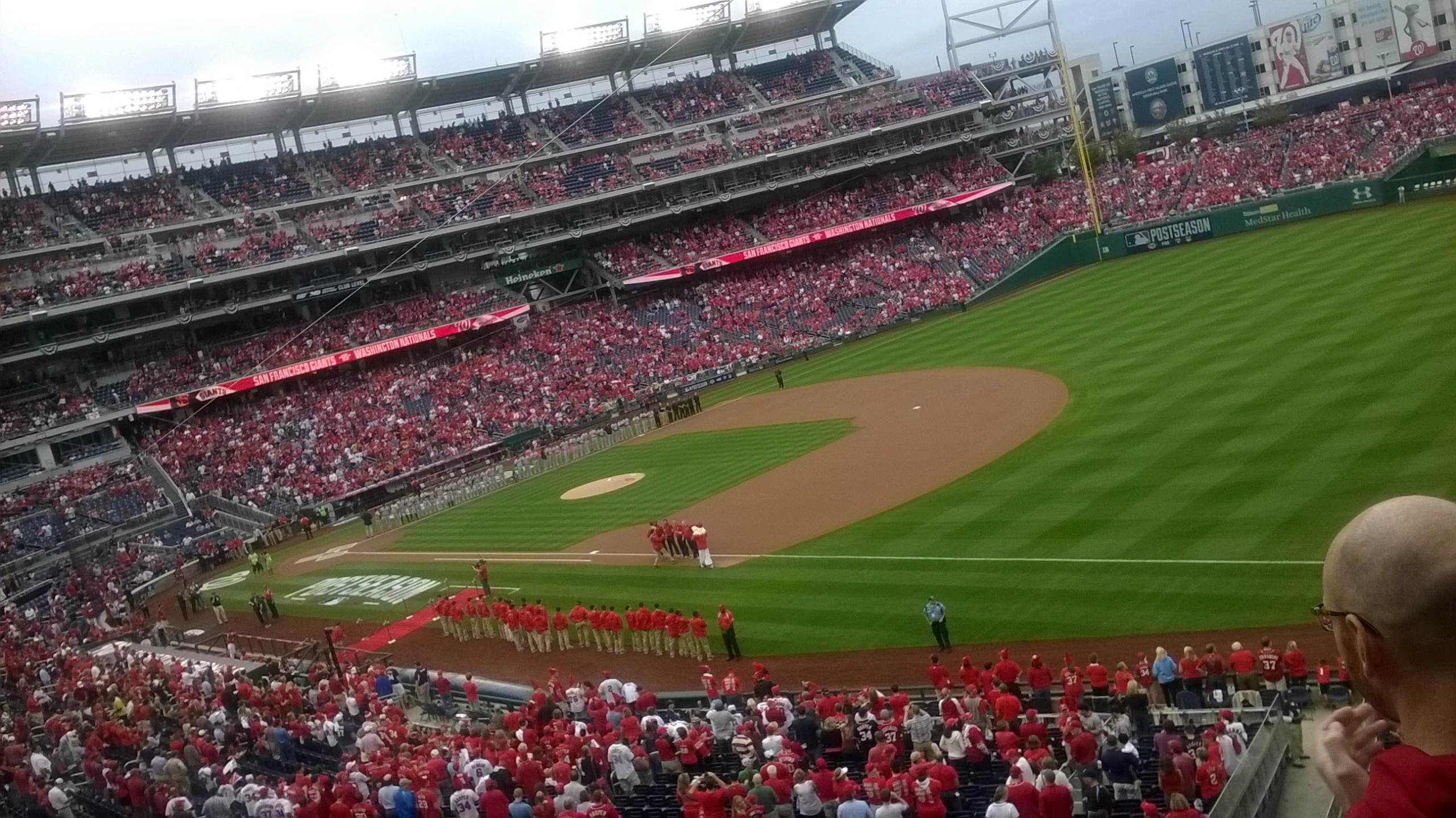 a large stadium full of people with a pitcher's mound