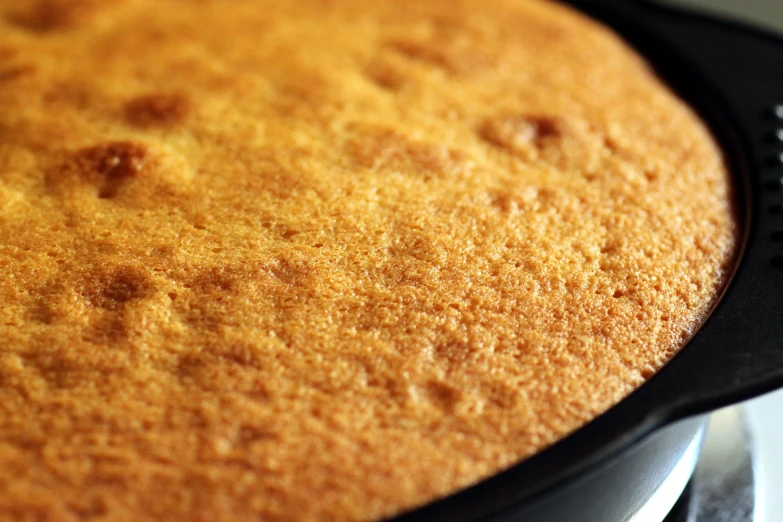 a cake crusting in a pan on a stove