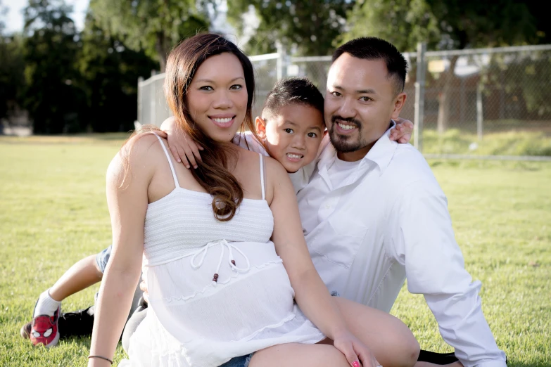 two people, one child and one adult posing for the camera