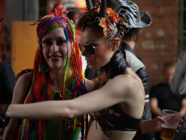 women wearing costume with brightly colored hair having fun