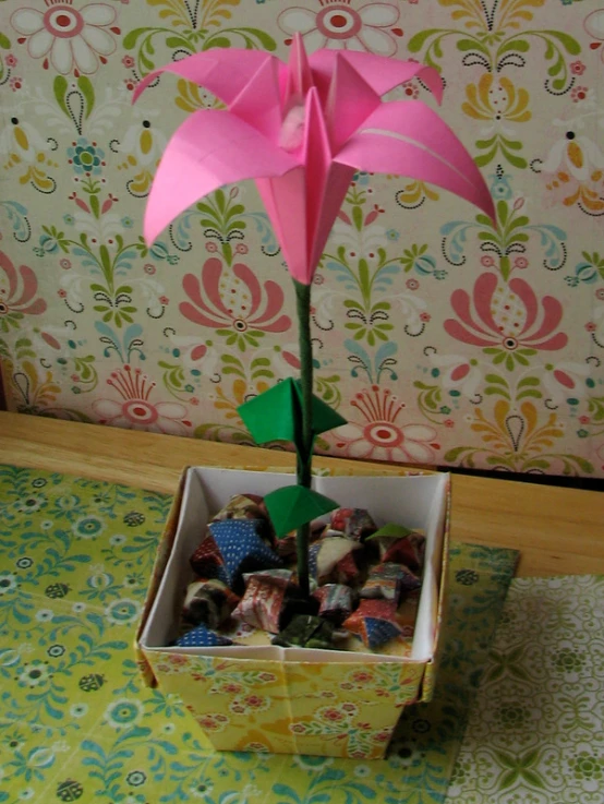 a potted plant with paper flowers in it