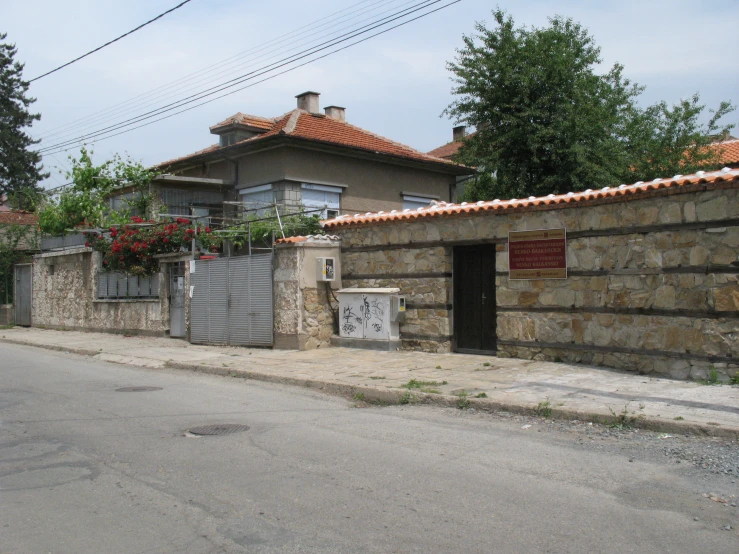 a brick house with vines growing up the roof