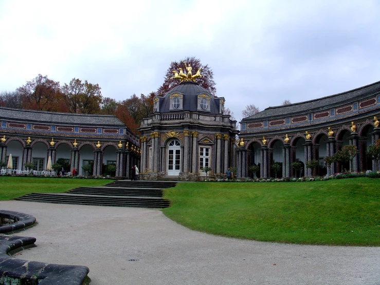 a large palace with lots of large pillars and doors