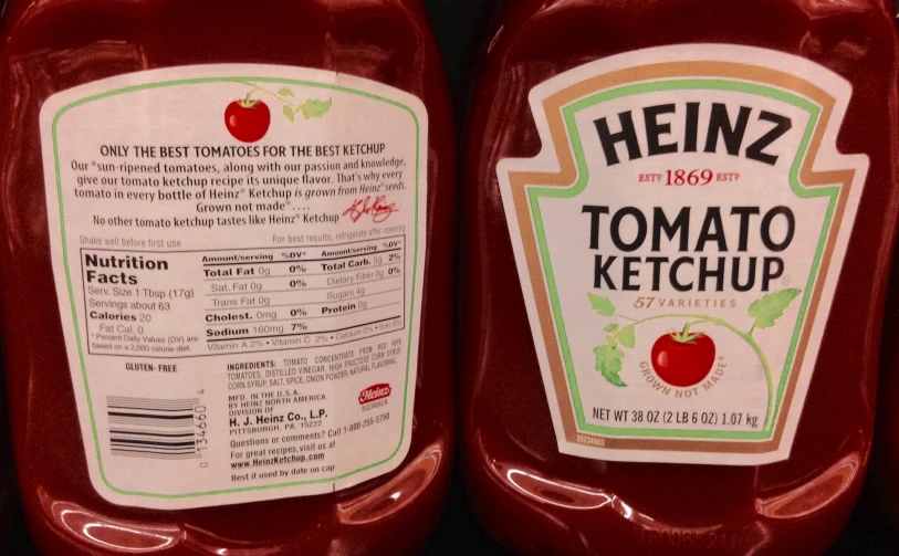 two plastic bottles of heinz's tomato ketchup sit side by side