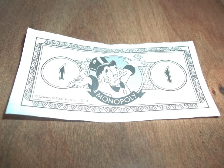 a drawing depicting monopoly character is shown on a paper