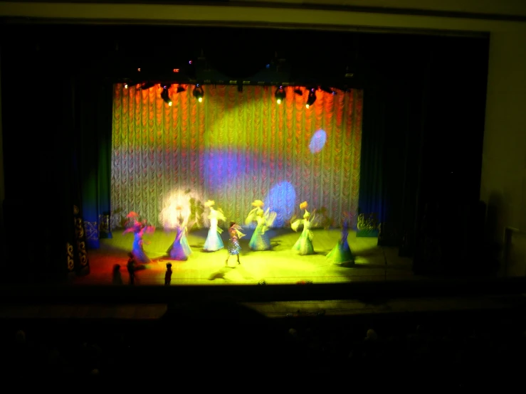 a theatre with people on the stage in front of them