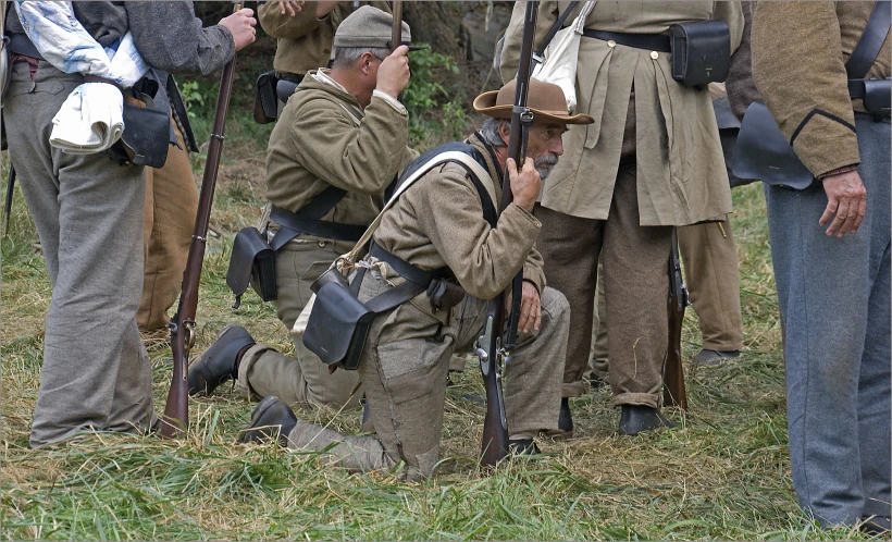 several soldiers are gathered around an officer wearing uniform