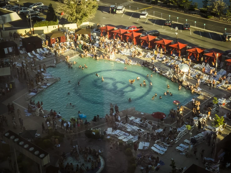 many people are on a crowded pool at night