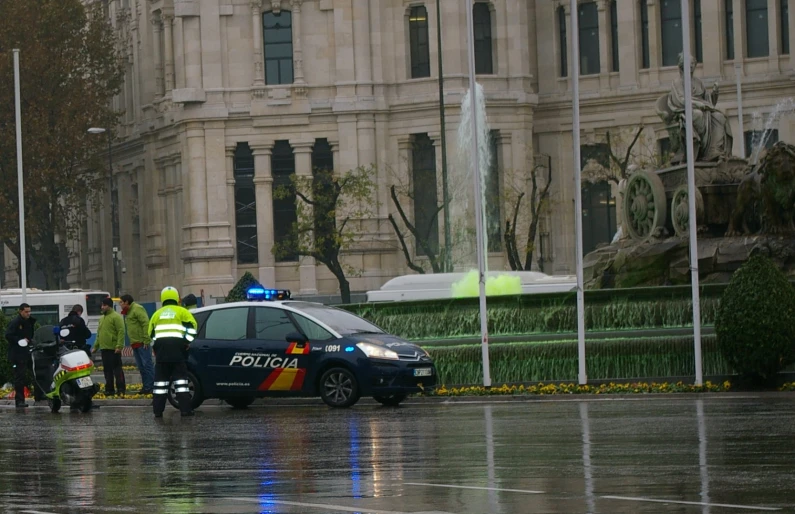 the police officers are working on the car