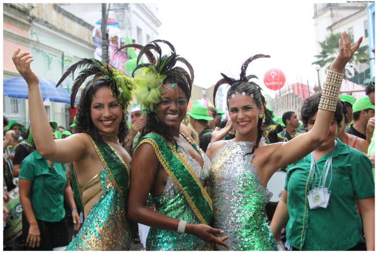 group of girls in green and gold outfits