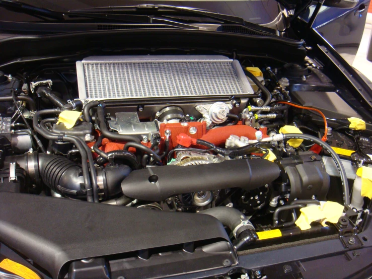 the engine of a car parked next to the hood