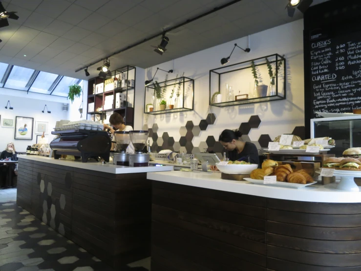 the interior of a restaurant with many dishes and coffee cups