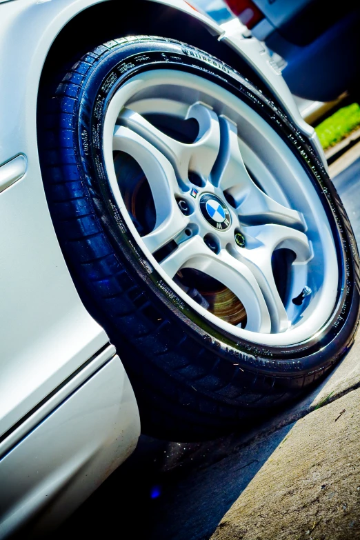 a tire that is parked next to some cars