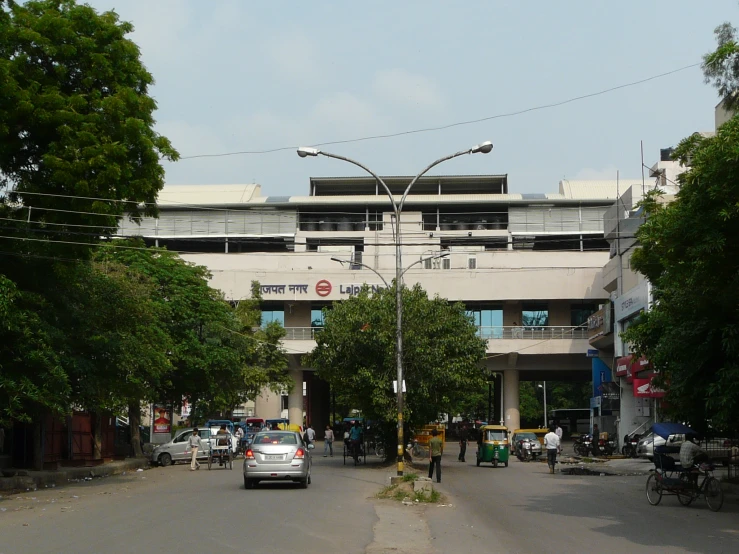 two cars sitting on the street of a street