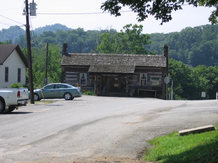 there is a small cabin in the middle of the road