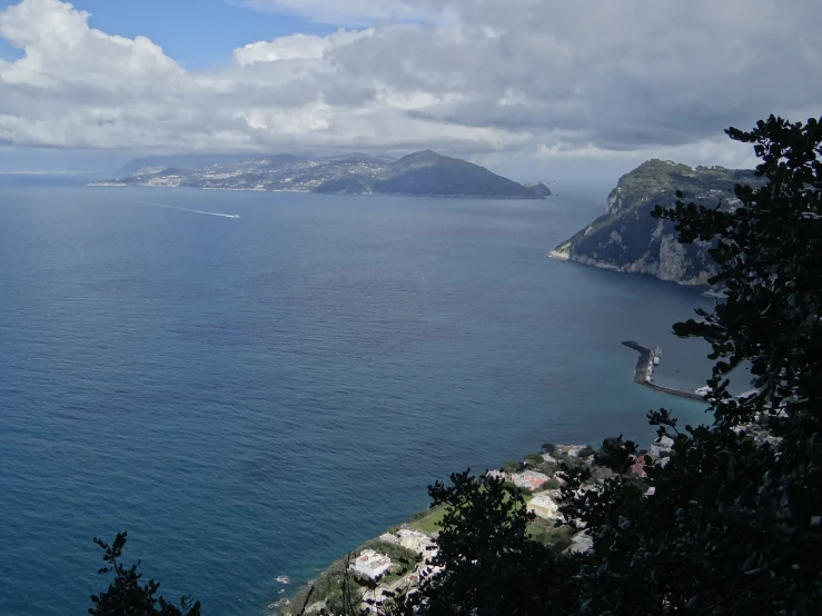 an empty island with a large body of water next to a town