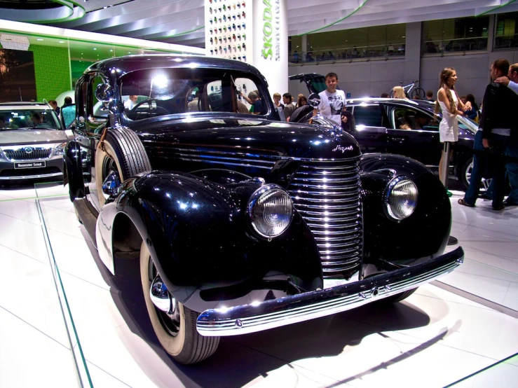 some cars are on display at a car show