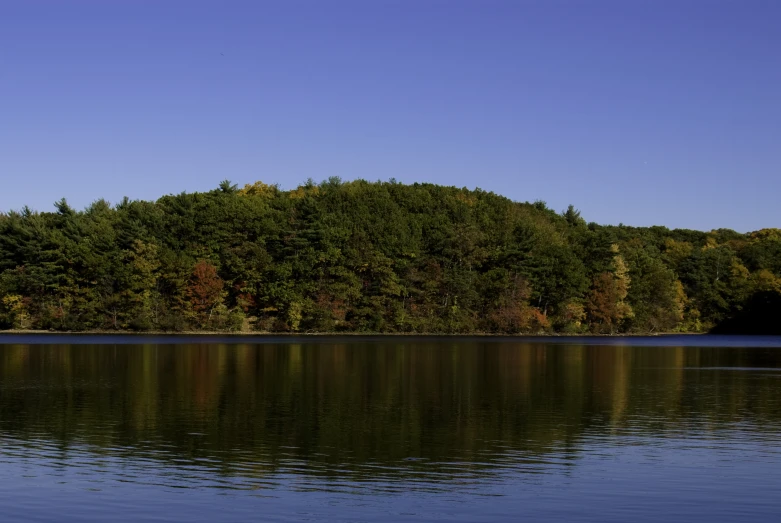 a small boat floating on top of a body of water