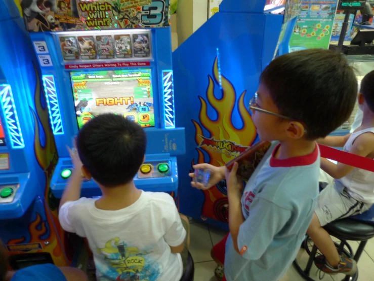 some little boys playing some video games