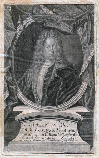 a man in an oval frame on top of a book